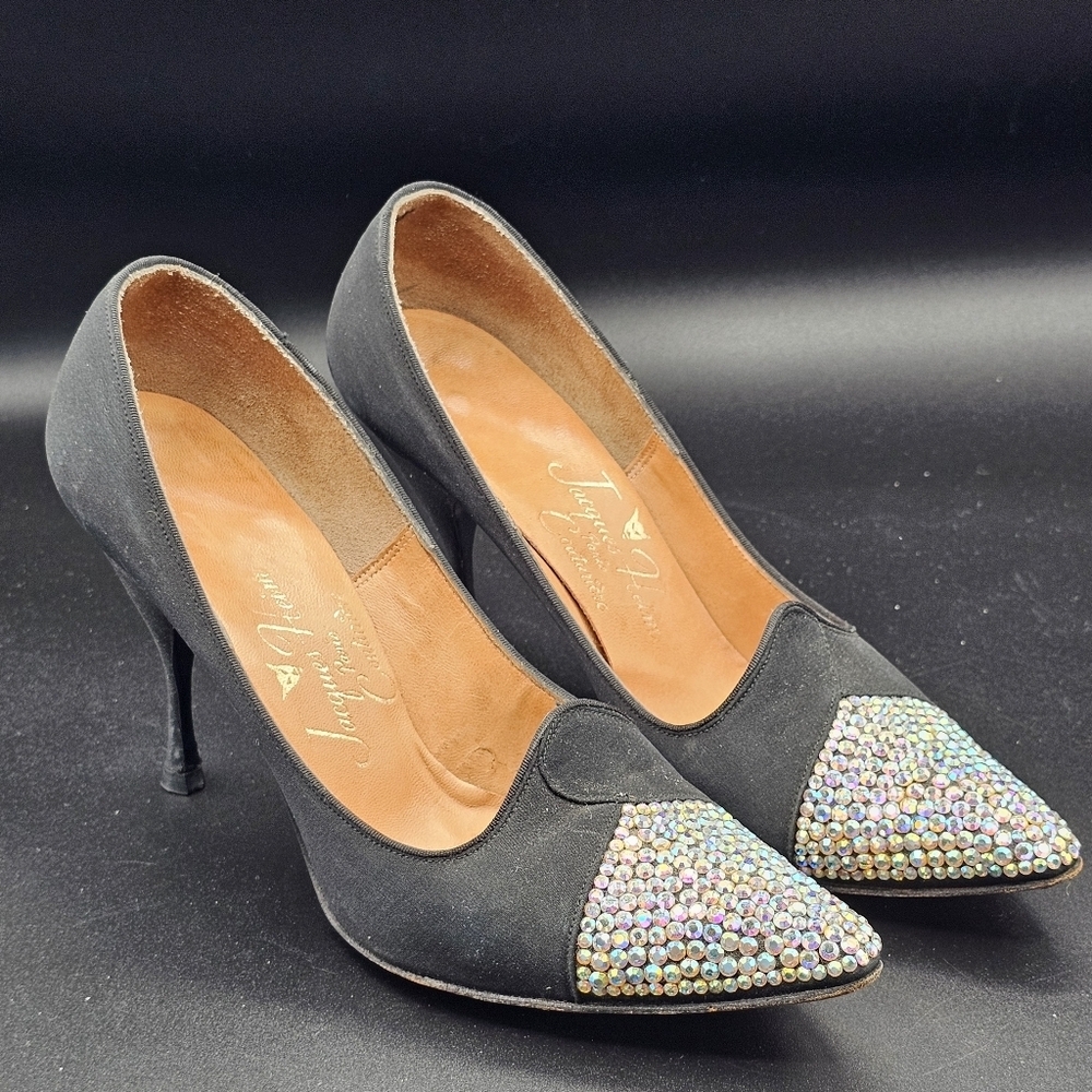 Jacques Heim pumps with a rhinestone-embellished toe.
